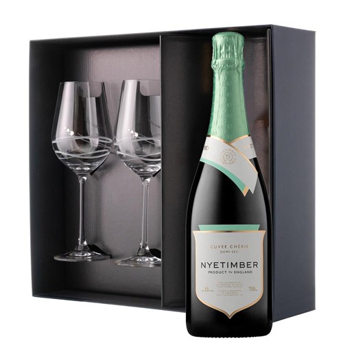 This luxurious gift set is the perfect choice for those who appreciate fine sparkling wine and refined glassware. Featuring a bottle of Nyetimber Curvee Cherie Demi-Sec NV English Sparkling Wine paired with two exquisite Venezia Glasses adorned with Swarovski Crystals, this set is beautifully presente